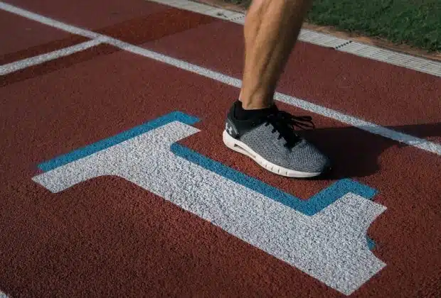 person running on tracking field